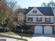 Charming two-story home with a two-car garage and well-maintained landscaping at 3700 Newhalem Sw St, Atlanta, GA 30331