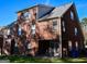 Back exterior view of a brick house featuring a covered patio area at 3700 Newhalem Sw St, Atlanta, GA 30331