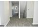 Hallway featuring modern vinyl flooring and a view of a bathroom at the end of the hallway at 3700 Newhalem Sw St, Atlanta, GA 30331