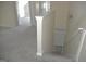Hallway with carpet floor and stairs leading to the basement at 3700 Newhalem Sw St, Atlanta, GA 30331