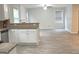 Spacious open-concept space with modern flooring, open to the kitchen area at 3700 Newhalem Sw St, Atlanta, GA 30331