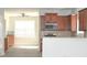 Open-concept living area with modern flooring and a view into the kitchen at 3700 Newhalem Sw St, Atlanta, GA 30331