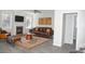 Cozy living room with a fireplace, a plush leather sofa, and modern décor at 3700 Newhalem Sw St, Atlanta, GA 30331
