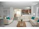 Spacious open-concept living area with stylish furnishings and an integrated kitchen at 3700 Newhalem Sw St, Atlanta, GA 30331