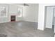 Bright and airy living room with a cozy fireplace and modern flooring at 3700 Newhalem Sw St, Atlanta, GA 30331