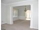 Bright living room with wainscoting and chandelier, perfect for entertaining guests at 3700 Newhalem Sw St, Atlanta, GA 30331