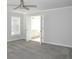 Bright main bedroom featuring durable carpet floors, ceiling fan, and ensuite bathroom at 3700 Newhalem Sw St, Atlanta, GA 30331