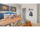 Inviting bedroom with sports-themed decor and ample storage at 139 Oakchase Park Ln, Hampton, GA 30228