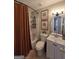 Bathroom with shower-tub combo, white vanity, floral art, and modern fixtures at 10178 Top Tree Ct, Jonesboro, GA 30238