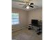 Neutral bedroom with a ceiling fan and natural light at 10178 Top Tree Ct, Jonesboro, GA 30238