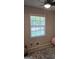 Bedroom featuring a ceiling fan, neutral walls, and a window providing natural light at 10178 Top Tree Ct, Jonesboro, GA 30238