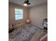 Cozy bedroom with a fan, window and rug at 10178 Top Tree Ct, Jonesboro, GA 30238