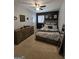 Decorated bedroom features a queen-sized bed, black accent wall, wood dresser and modern decor at 10178 Top Tree Ct, Jonesboro, GA 30238