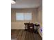 Cozy dining area with vinyl flooring and natural light from the window at 10178 Top Tree Ct, Jonesboro, GA 30238