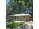 Charming brick home with a well-manicured lawn and mature trees at 10178 Top Tree Ct, Jonesboro, GA 30238