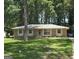Charming brick home with a well-manicured lawn and mature trees at 10178 Top Tree Ct, Jonesboro, GA 30238