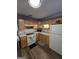 Charming kitchen with white appliances, ample cabinet space, and vinyl plank flooring at 10178 Top Tree Ct, Jonesboro, GA 30238