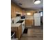 Charming kitchen with white appliances, ample cabinet space, and vinyl plank flooring at 10178 Top Tree Ct, Jonesboro, GA 30238