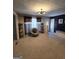 Inviting living room with neutral carpet and modern lighting at 10178 Top Tree Ct, Jonesboro, GA 30238