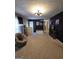Inviting living room with neutral carpet and modern lighting at 10178 Top Tree Ct, Jonesboro, GA 30238