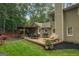 Spacious backyard featuring a wooden deck, lush lawn, and a charming pergola at 4080 Derby Dr, Cumming, GA 30040