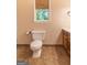 Bathroom with a ceramic toilet and tile flooring at 4080 Derby Dr, Cumming, GA 30040