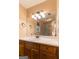 Neutral bathroom with vanity, large mirror and an inset sink at 4080 Derby Dr, Cumming, GA 30040