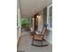 View of a lovely porch with rocking chairs, decorative lights, and lots of space to sit and relax at 4080 Derby Dr, Cumming, GA 30040