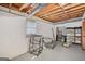 Unfinished basement with painted walls, exposed ceiling, and natural light at 1214 Lambeth Se Way, Conyers, GA 30013
