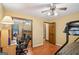 Bedroom with bunk beds, closet with mirror doors, ceiling fan, and a desk with chair at 1214 Lambeth Se Way, Conyers, GA 30013