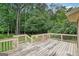Rustic wooden deck overlooking the backyard, perfect for relaxing and entertaining at 1214 Lambeth Se Way, Conyers, GA 30013