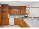 Kitchen featuring wood cabinetry, stainless steel sink, and plenty of counter space at 1214 Lambeth Se Way, Conyers, GA 30013