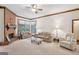 Bright living room featuring plush seating, a brick fireplace, and natural light at 1214 Lambeth Se Way, Conyers, GA 30013
