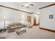 Open living room with neutral carpet, plush seating and classic trim at 1214 Lambeth Se Way, Conyers, GA 30013