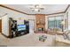Spacious living room with a cozy fireplace, neutral carpet, and lots of light at 1214 Lambeth Se Way, Conyers, GA 30013