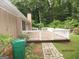Inviting back deck extends from the home, surrounded by well-maintained landscaping and providing a serene outdoor retreat at 5848 Navarre Ct, Stone Mountain, GA 30087