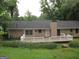 Lovely backyard and deck are surrounded by lush greenery and mature trees, providing a private outdoor space at 5848 Navarre Ct, Stone Mountain, GA 30087