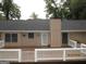 Backyard featuring a wooden deck with white railings, framed by lush green trees offering a cozy outdoor space at 5848 Navarre Ct, Stone Mountain, GA 30087