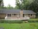 Lovely backyard and deck are surrounded by lush greenery and mature trees, providing a private outdoor space at 5848 Navarre Ct, Stone Mountain, GA 30087