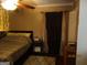 Bedroom with large bed and stylish lighting, offering a cozy and modern sleeping space at 5848 Navarre Ct, Stone Mountain, GA 30087