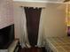 Warm bedroom with large bed, soft curtains, and ambient lighting, creating a relaxing atmosphere at 5848 Navarre Ct, Stone Mountain, GA 30087