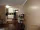 Eat-in kitchen features stainless steel appliances, white cabinets, and a decorative fish tank, blending functionality with style at 5848 Navarre Ct, Stone Mountain, GA 30087