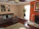 Cozy living room with a brown sectional, fireplace, and natural light from a large window at 5848 Navarre Ct, Stone Mountain, GA 30087