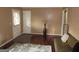 Stylish living room with hardwood floors, beige walls, a dark couch and tasteful decor at 5848 Navarre Ct, Stone Mountain, GA 30087