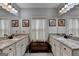 Bathroom features dual sinks with granite countertops, framed mirrors, and decorative accents at 3112 Patriot Sq, Marietta, GA 30064
