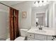 Bathroom featuring a vanity with marble countertop, toilet, and shower with curtain at 3112 Patriot Sq, Marietta, GA 30064