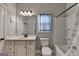 Bathroom features a vanity, mirror, and tub with shower, with neutral tones and natural light at 3112 Patriot Sq, Marietta, GA 30064