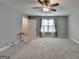 Spacious bedroom with neutral walls, carpet flooring, and a ceiling fan at 3112 Patriot Sq, Marietta, GA 30064
