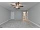 Spacious bedroom with neutral walls, carpet flooring, and a ceiling fan at 3112 Patriot Sq, Marietta, GA 30064