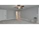 A large bedroom with neutral walls, carpet flooring, and ceiling fan at 3112 Patriot Sq, Marietta, GA 30064